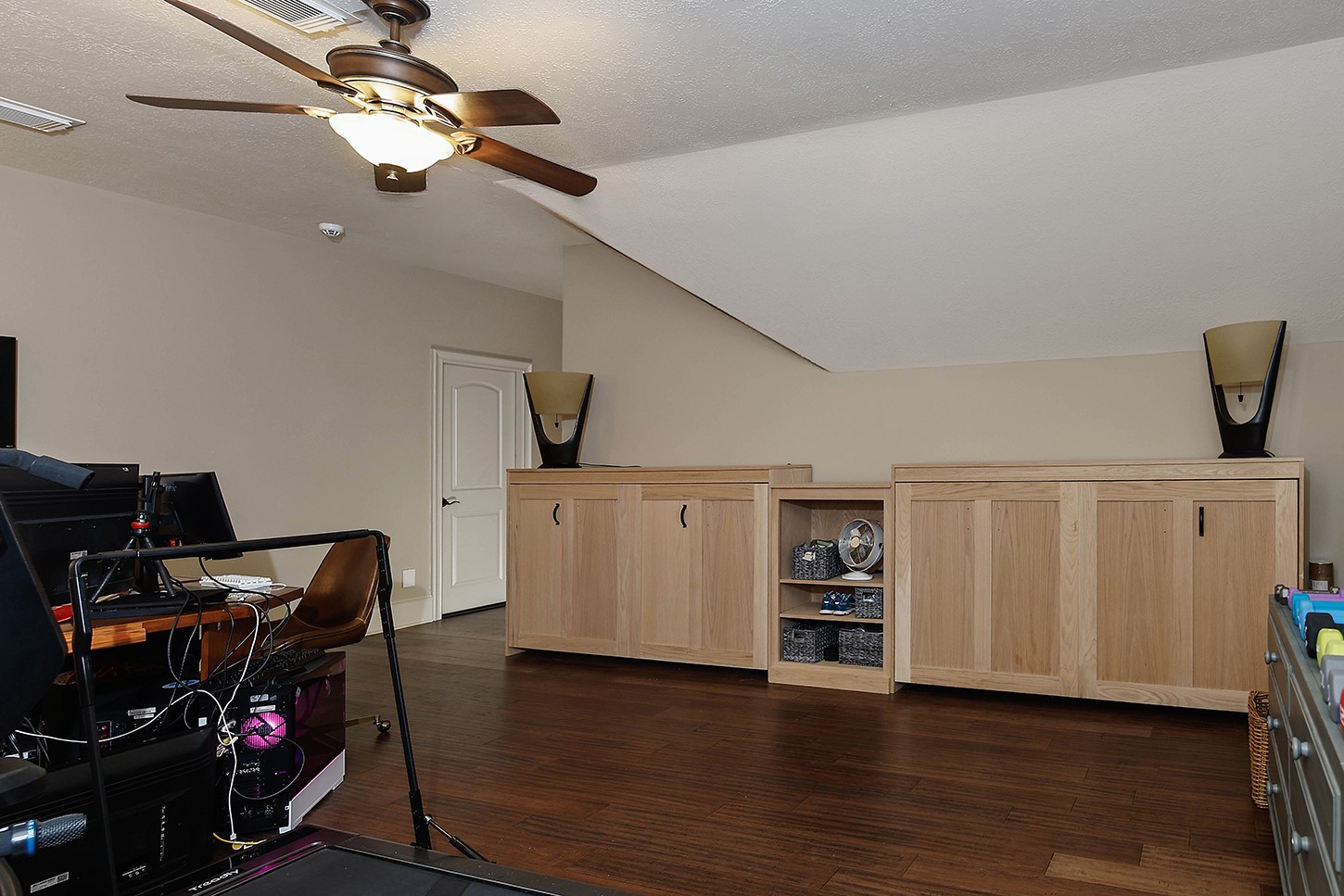 119 Angel Leaf Road The Woodlands, TX 77380 - Photo 38 of 50 a view of a workspace with furniture and wooden floor