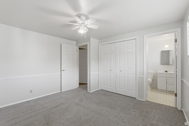 148 Tennyson Avenue Sandy, UT 84070 - Photo 21 of 55 Carpeted room with a ceiling fan, crown molding, and wainscoting