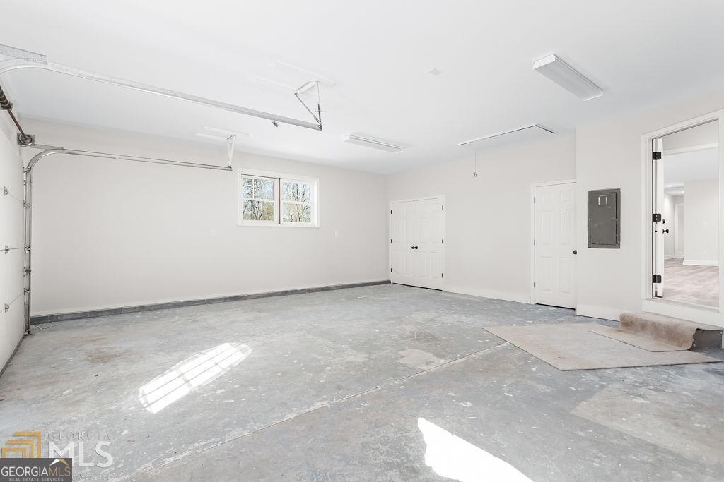 3077 Alec Mountain Road Clarkesville, GA 30523 - Photo 25 of 35 a view of a livingroom with a projector and a window