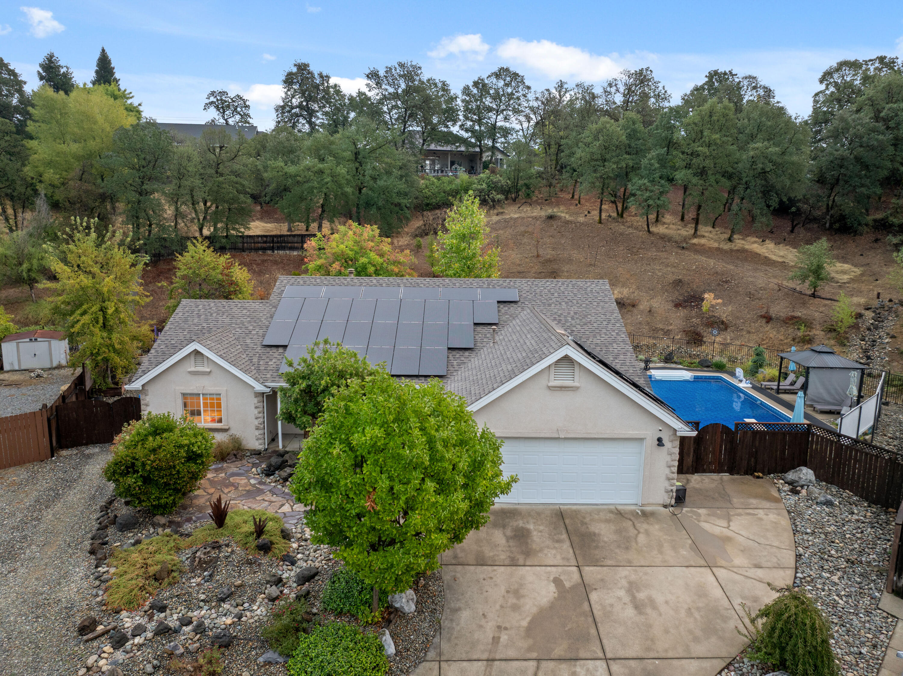19219 Nike Court Redding, CA 96003 - Photo 1 of 37 an aerial view of house with yard and trees in the background