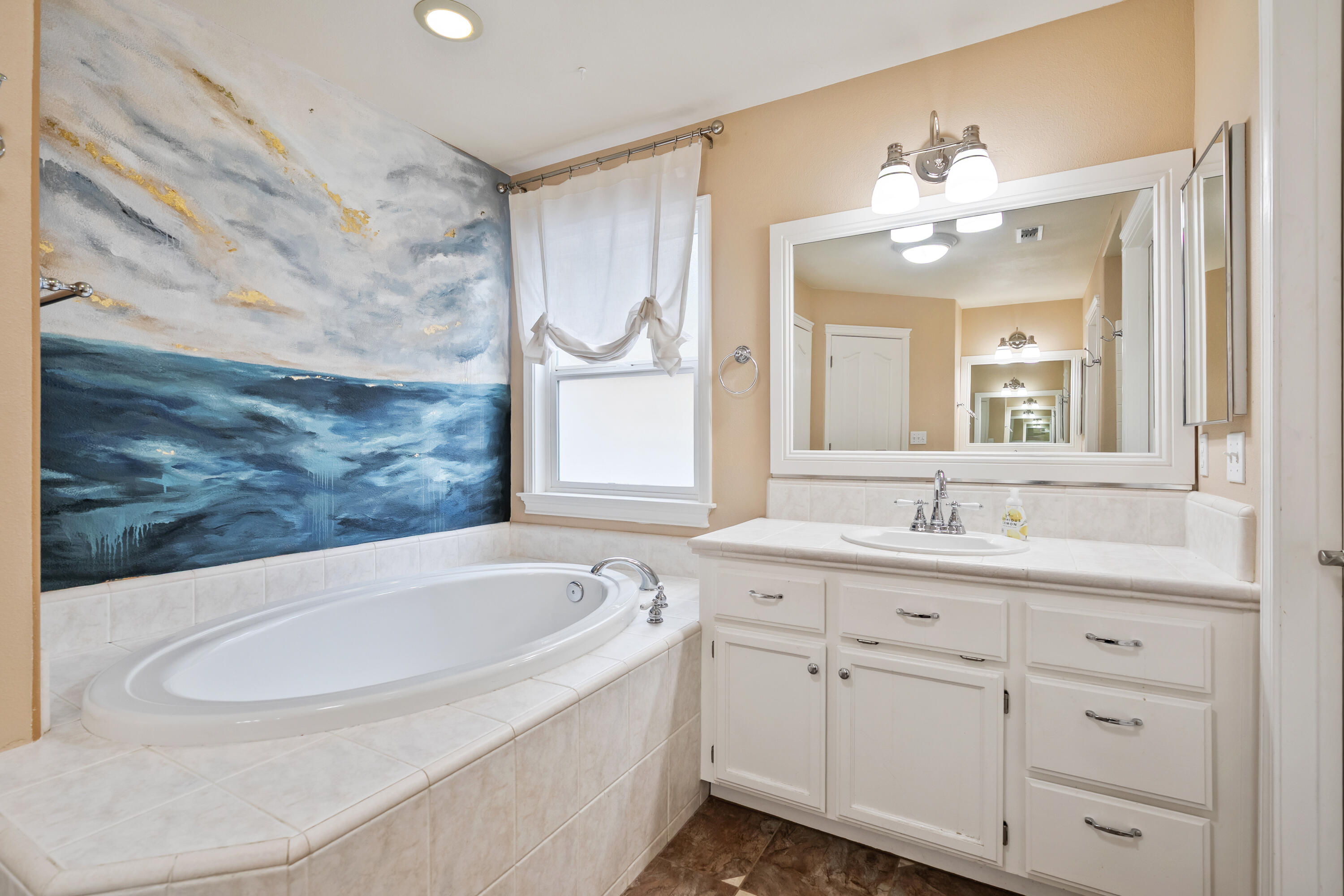 19219 Nike Court Redding, CA 96003 - Photo 20 of 37 a bathroom with a granite countertop sink a large mirror and vanity