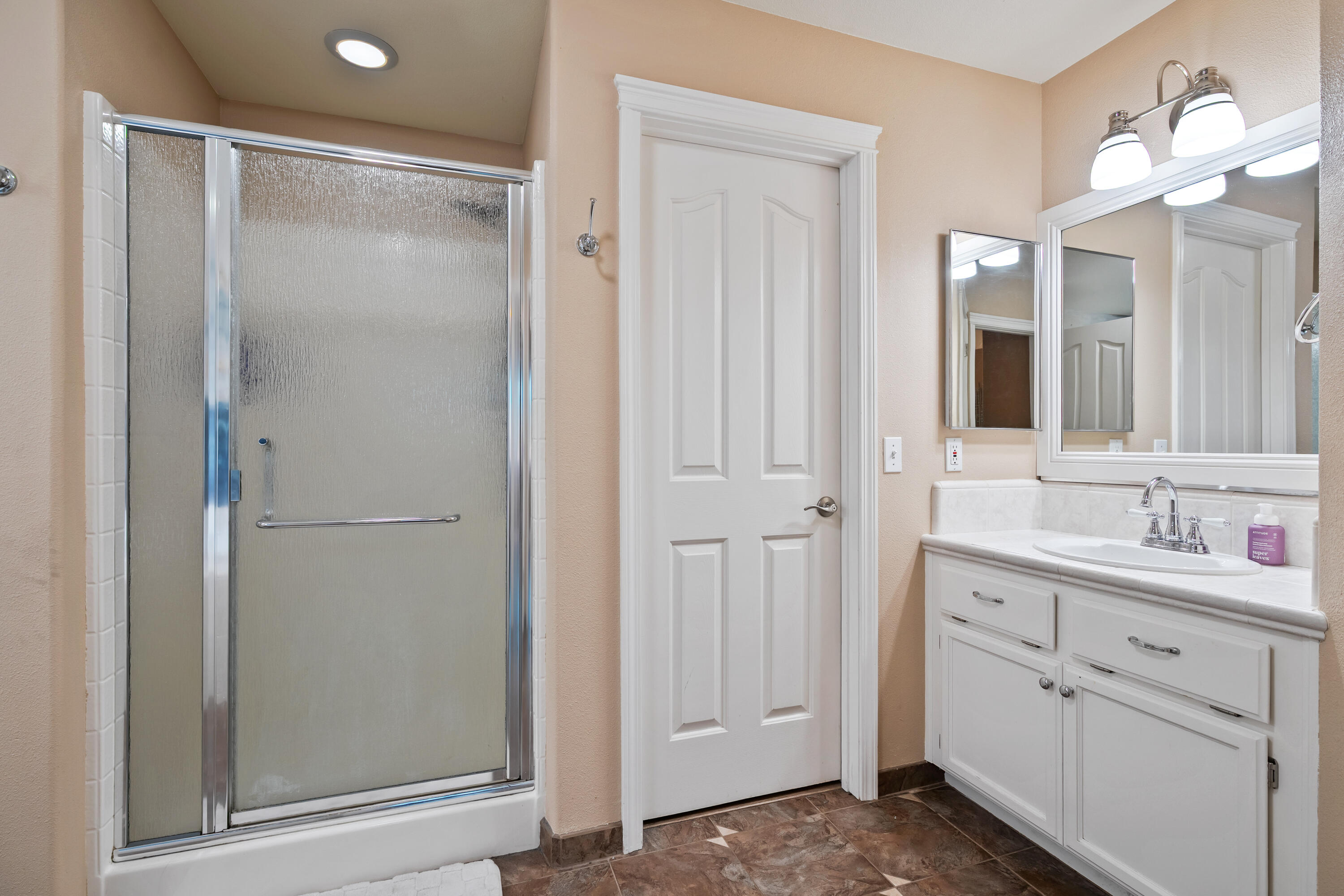 19219 Nike Court Redding, CA 96003 - Photo 21 of 37 a bathroom with a shower sink and mirror