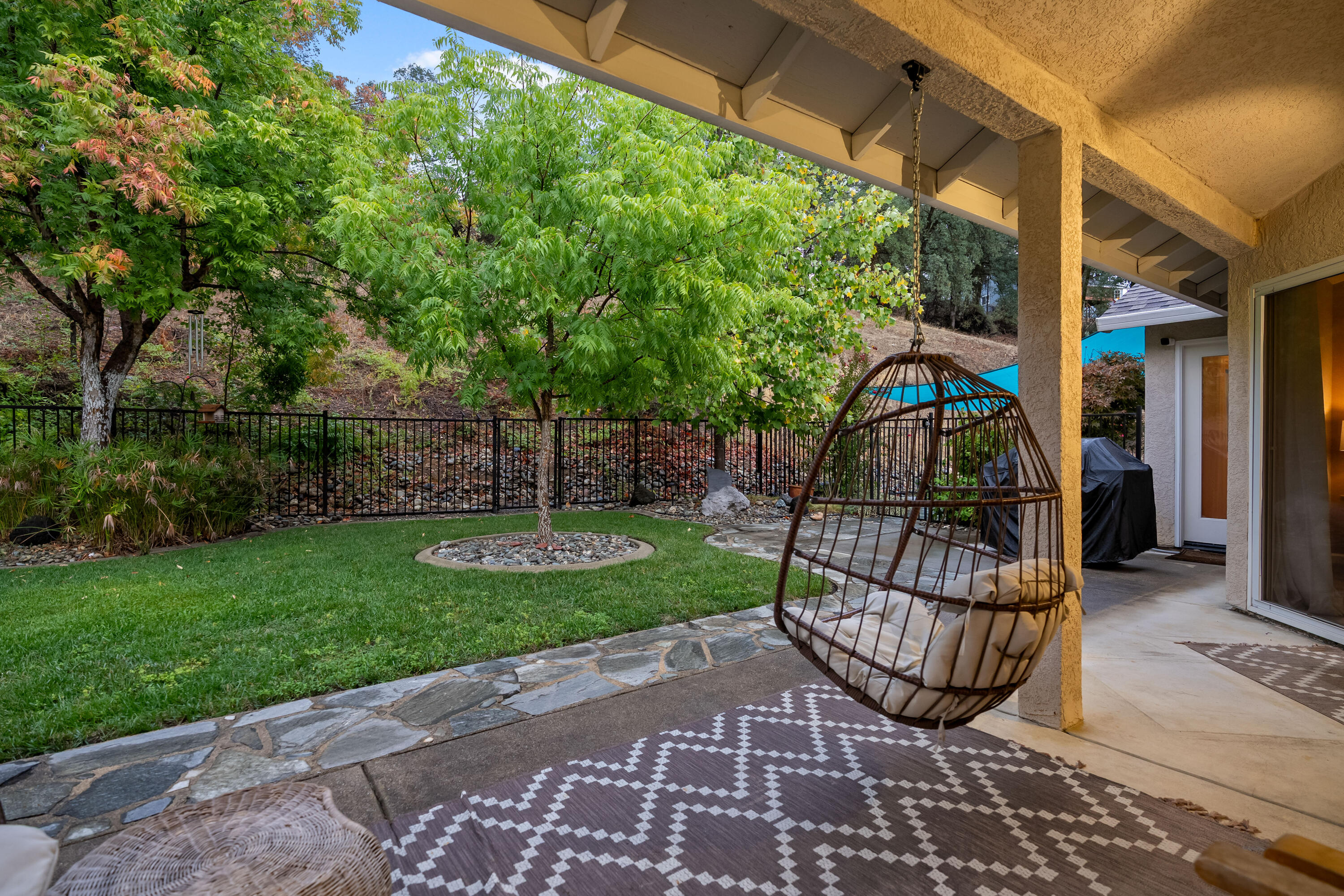 19219 Nike Court Redding, CA 96003 - Photo 24 of 37 a view of a chair and tables in the patio