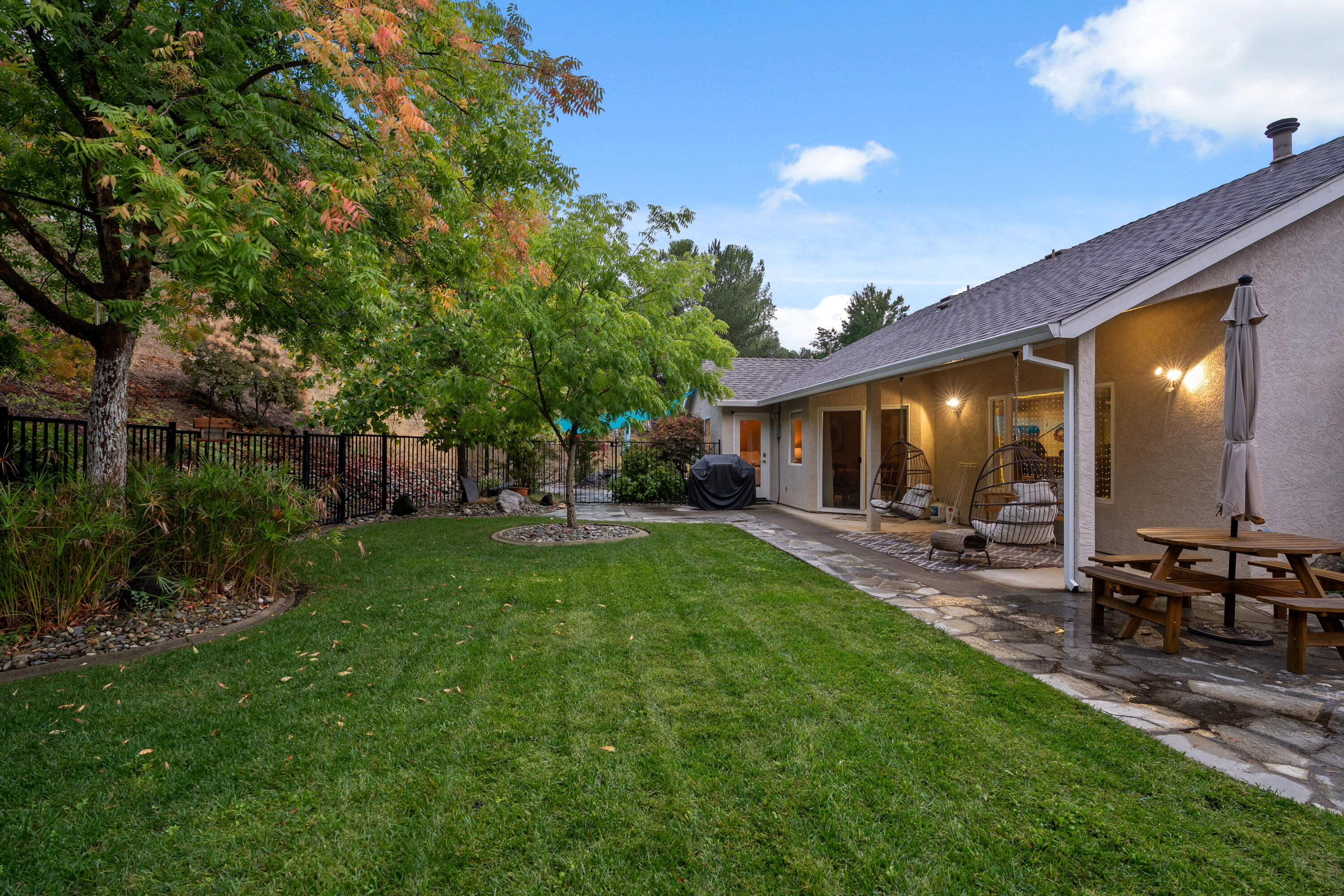 19219 Nike Court Redding, CA 96003 - Photo 25 of 37 a view of a house with backyard and sitting area