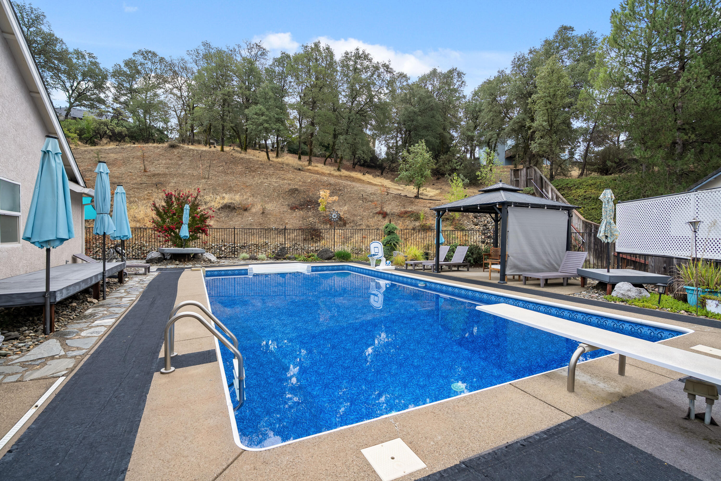 19219 Nike Court Redding, CA 96003 - Photo 29 of 37 a view of a patio with swimming pool