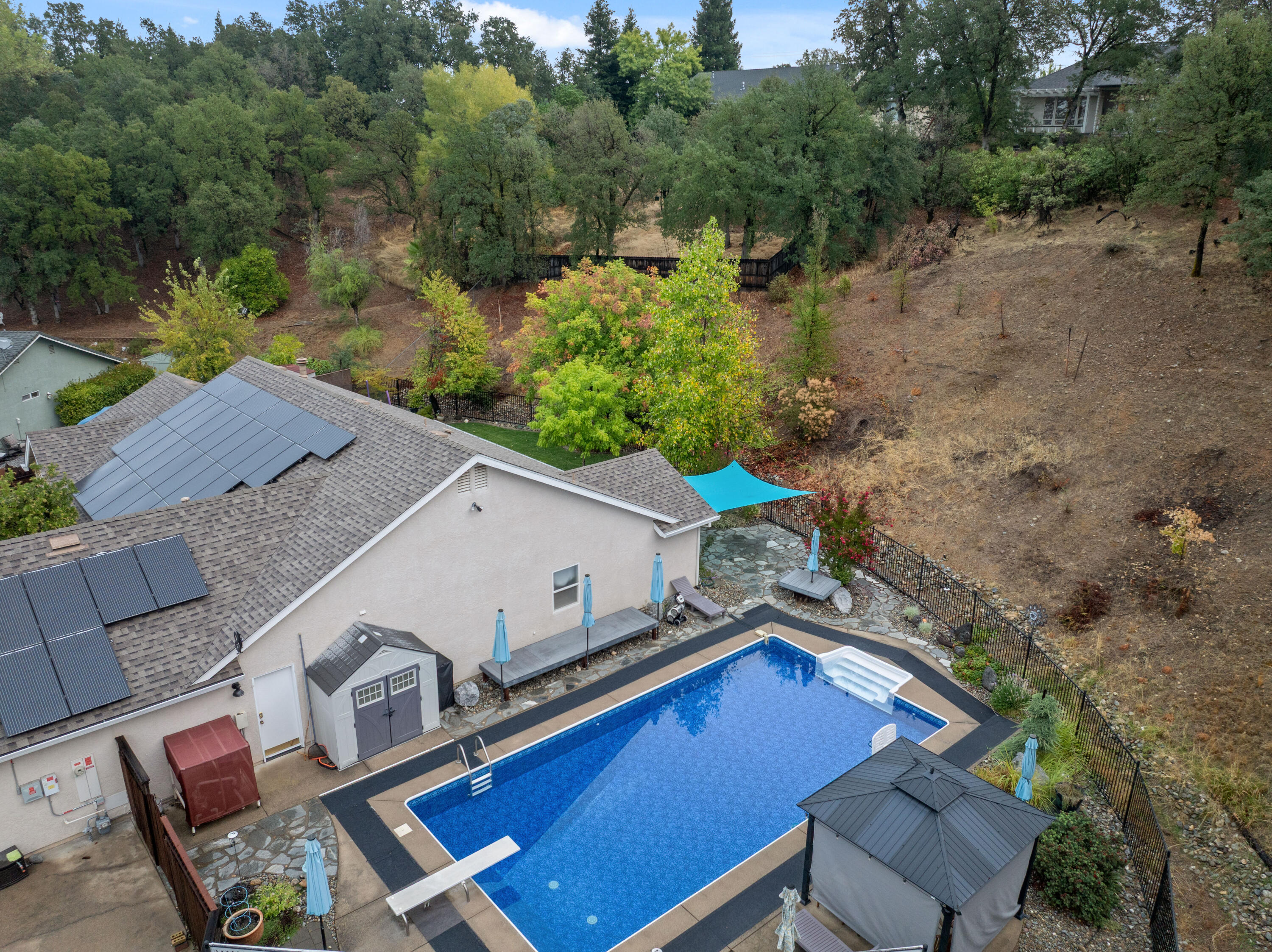 19219 Nike Court Redding, CA 96003 - Photo 31 of 37 an aerial view of a house with a yard pool patio and outdoor seating