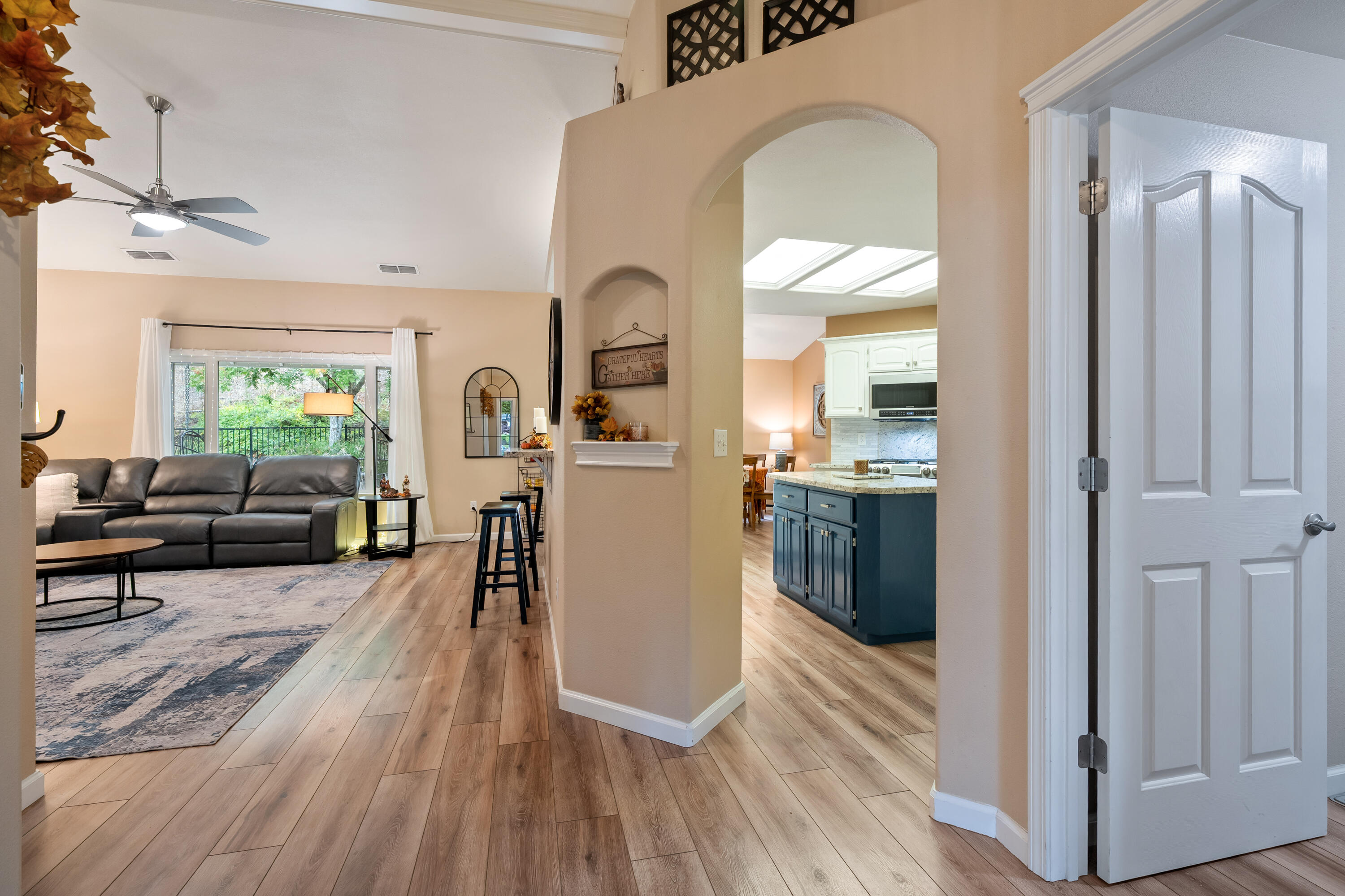 19219 Nike Court Redding, CA 96003 - Photo 4 of 37 a living room with furniture a large window and wooden floor