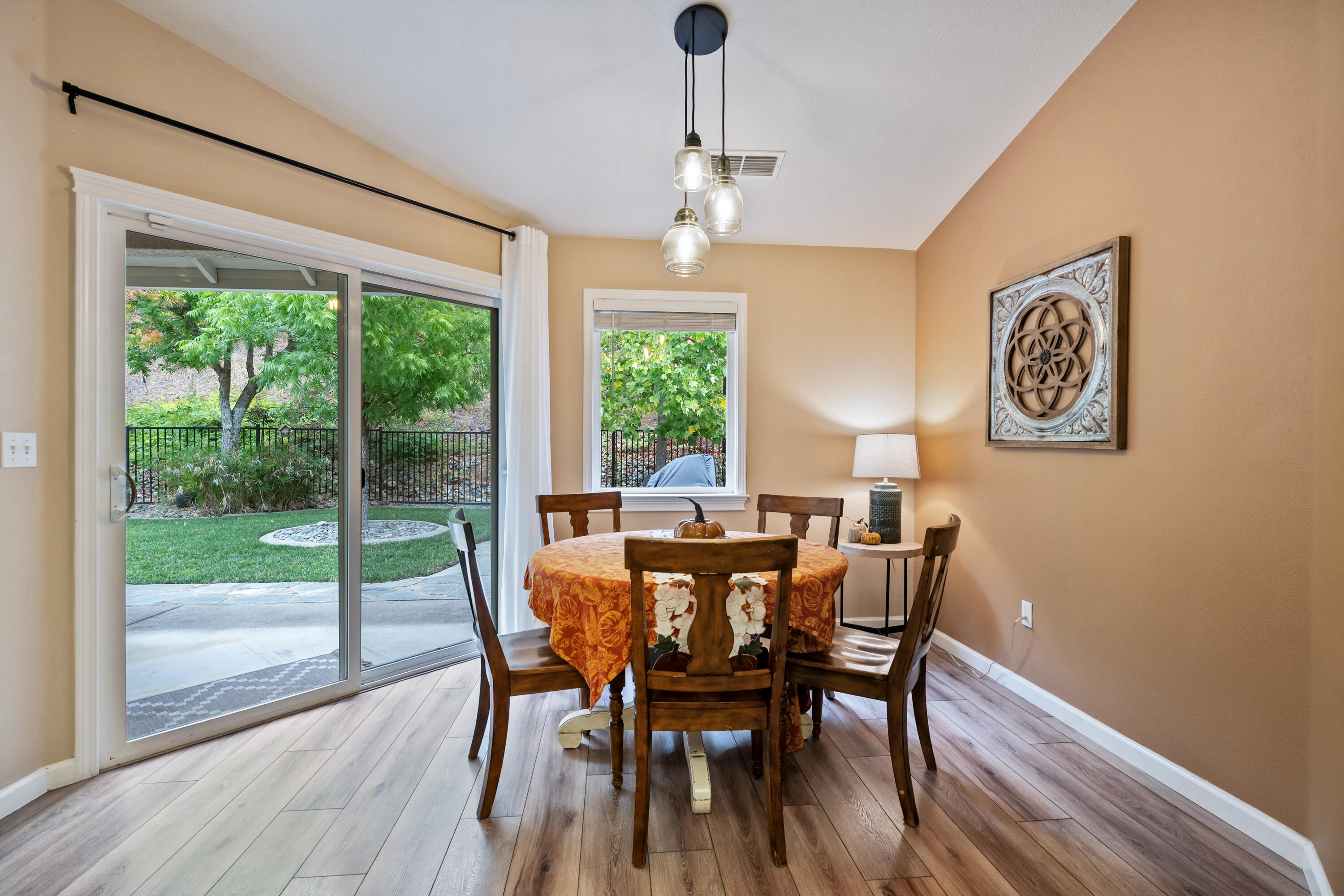 19219 Nike Court Redding, CA 96003 - Photo 8 of 37 a view of a dining room with furniture window and wooden floor