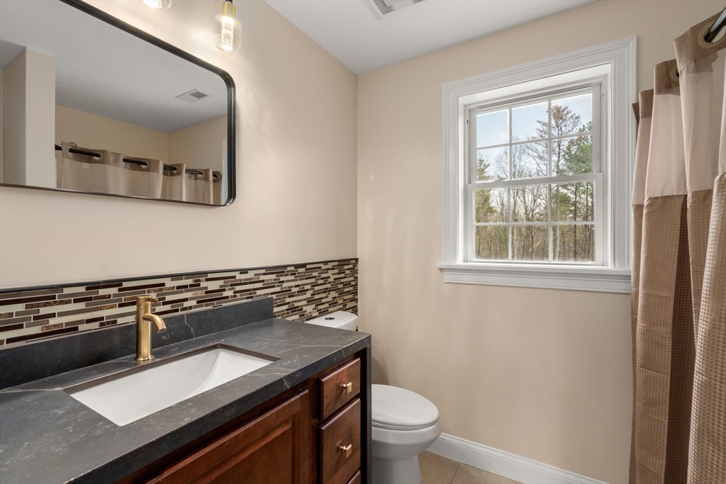 2 Britlees Way Dudley, MA 01571 - Photo 19 of 40 a kitchen with a stove and a sink