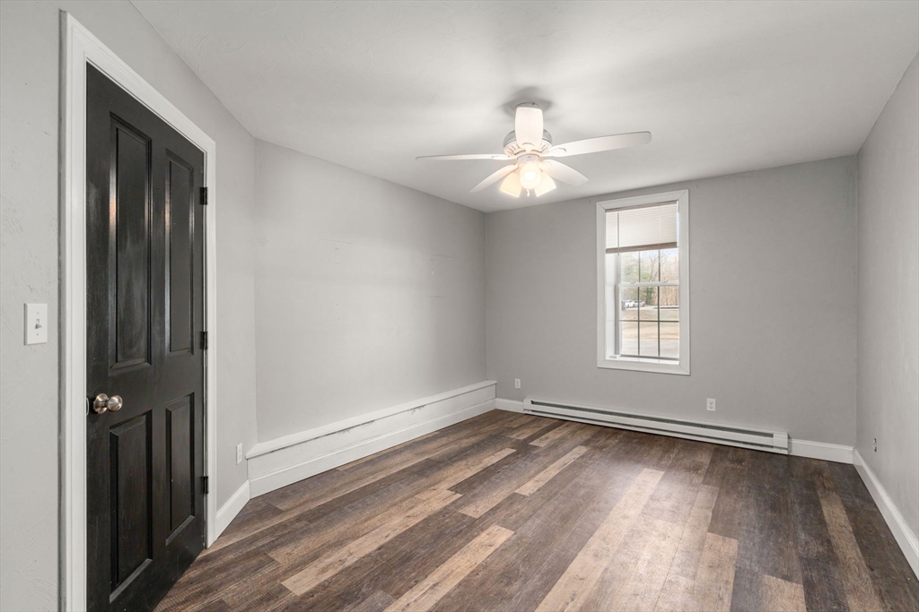 2 Britlees Way Dudley, MA 01571 - Photo 20 of 40 wooden floor in an empty room with a window