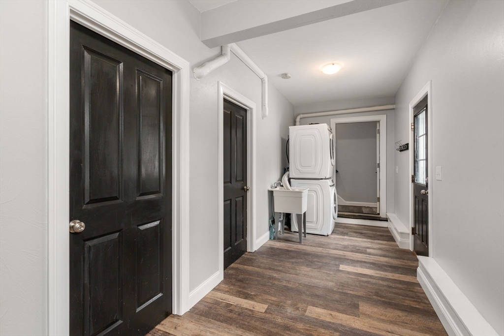 2 Britlees Way Dudley, MA 01571 - Photo 25 of 40 a view of a hallway with wooden shelves