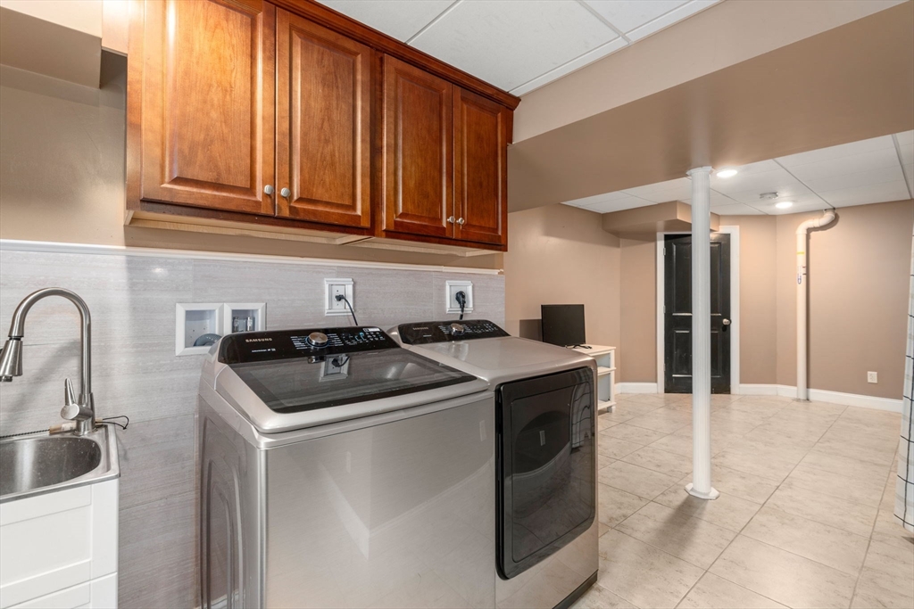 2 Britlees Way Dudley, MA 01571 - Photo 26 of 40 a kitchen with stainless steel appliances granite countertop a sink stove and cabinets