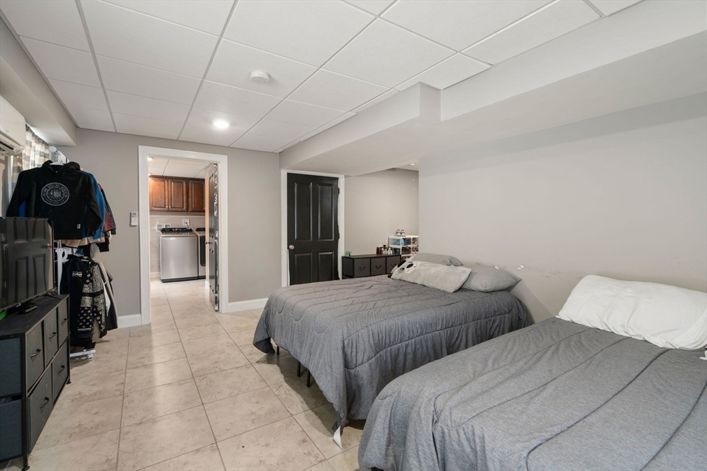 2 Britlees Way Dudley, MA 01571 - Photo 28 of 40 a bedroom with two bed and a walk in closet