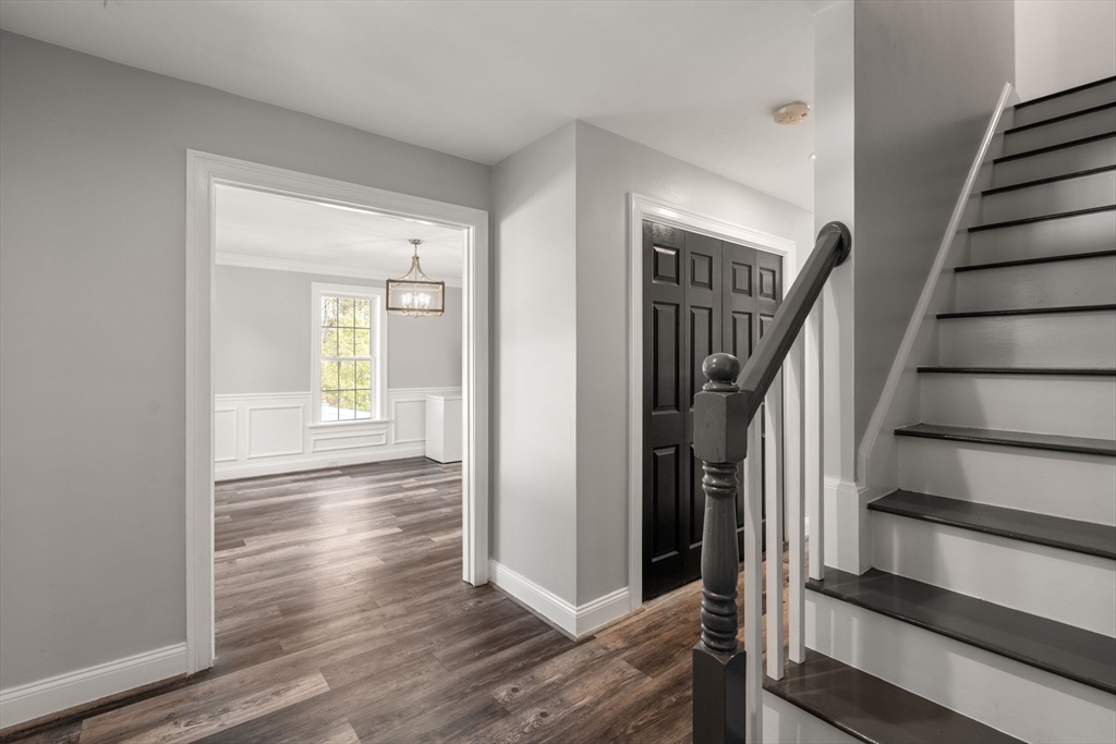 2 Britlees Way Dudley, MA 01571 - Photo 3 of 40 a view of entryway with wooden floor and stairs