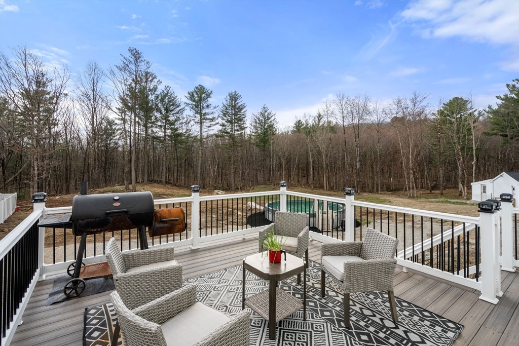 2 Britlees Way Dudley, MA 01571 - Photo 31 of 40 a view of a chairs and table on the roof deck
