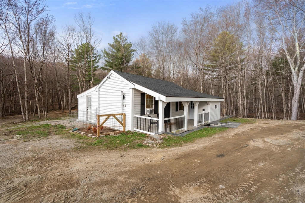 2 Britlees Way Dudley, MA 01571 - Photo 33 of 40 a house with trees in front of it