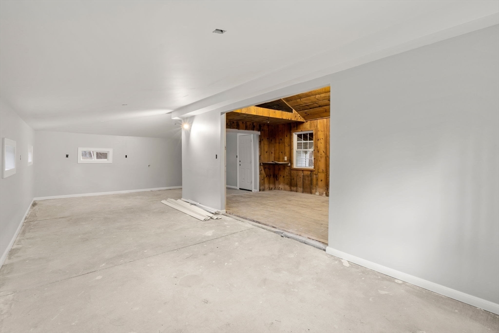 2 Britlees Way Dudley, MA 01571 - Photo 34 of 40 a view of a hallway with wooden shelves