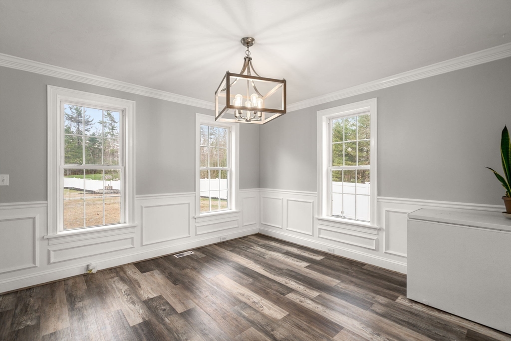 2 Britlees Way Dudley, MA 01571 - Photo 5 of 40 a view of empty room with wooden floor and fan