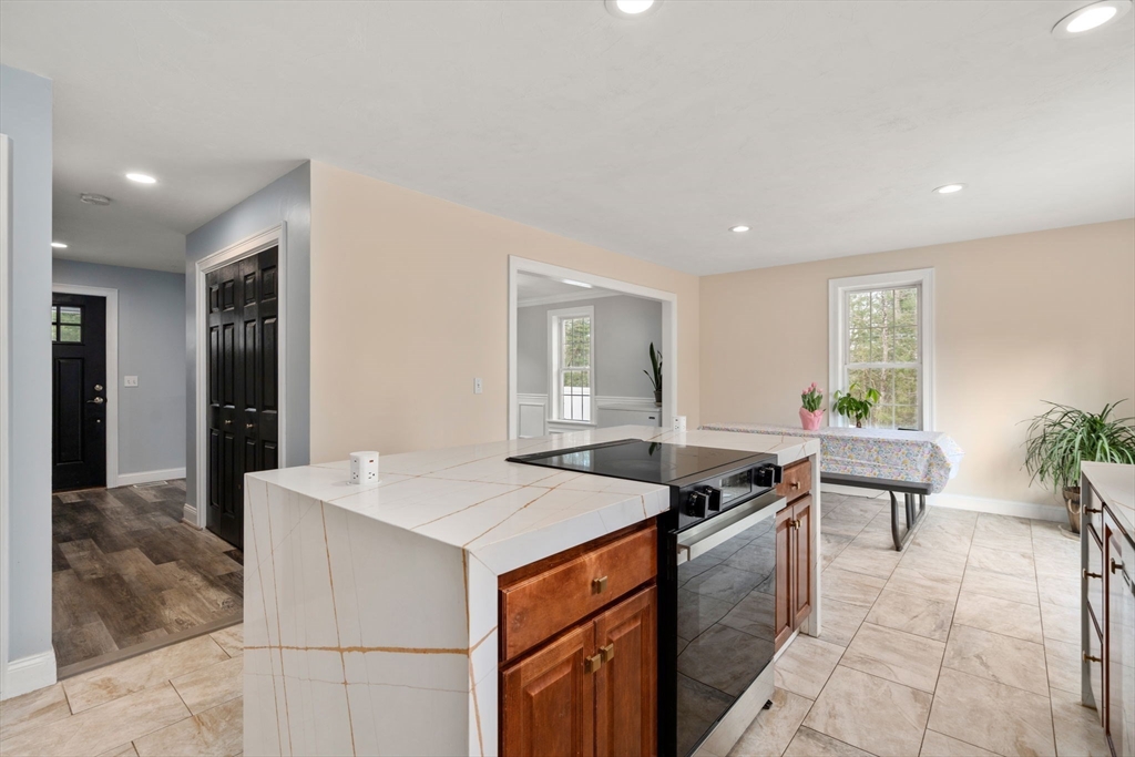 2 Britlees Way Dudley, MA 01571 - Photo 8 of 40 a kitchen that has a sink and a stove in it