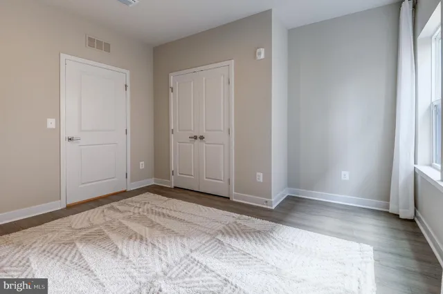 a view of bathroom with a sink and mirror
