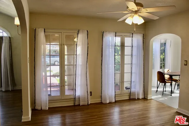 a view of a livingroom with furniture and hardwood floor