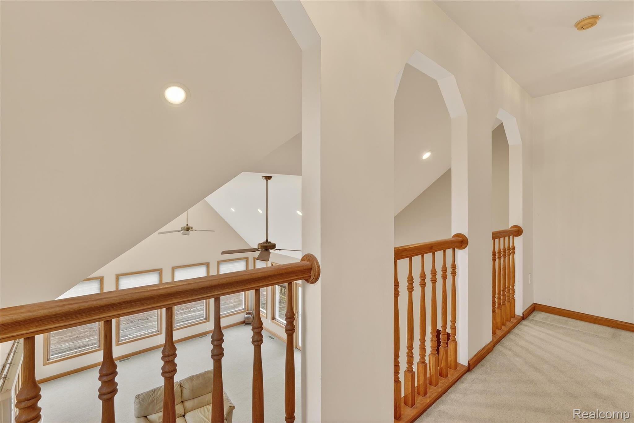 5640 Fisher Road Howell, MI 48855 - Photo 26 of 66 Hallway with light colored carpet and a high ceiling