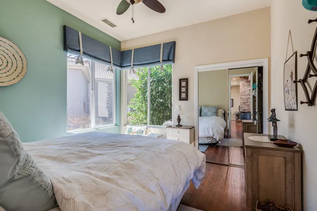 a bed room with a bed and a window