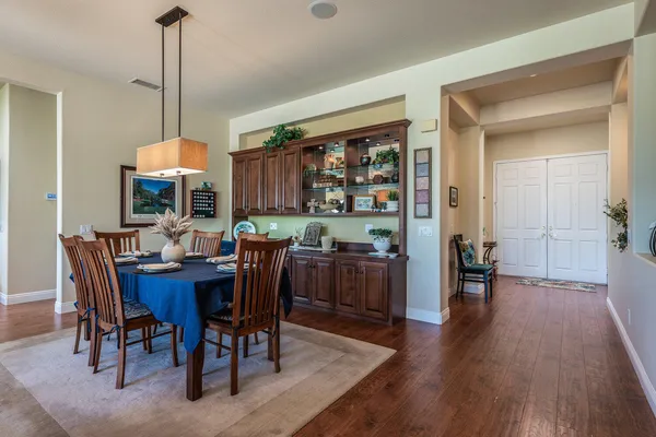 a view of a dining room with furniture window and wooden floor