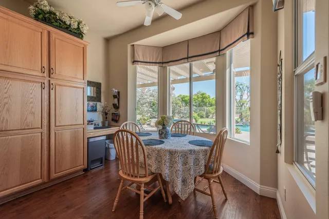 a view of a dining room with furniture window and wooden floor
