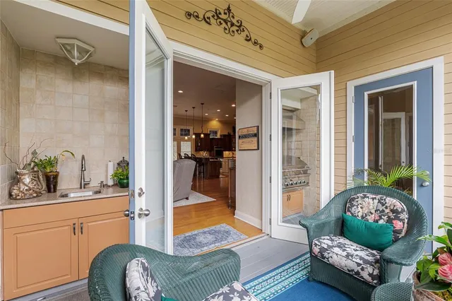 a dining room with furniture and wooden floor