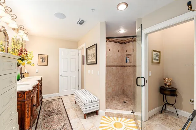 a view of a hallway with a cabinet and a window