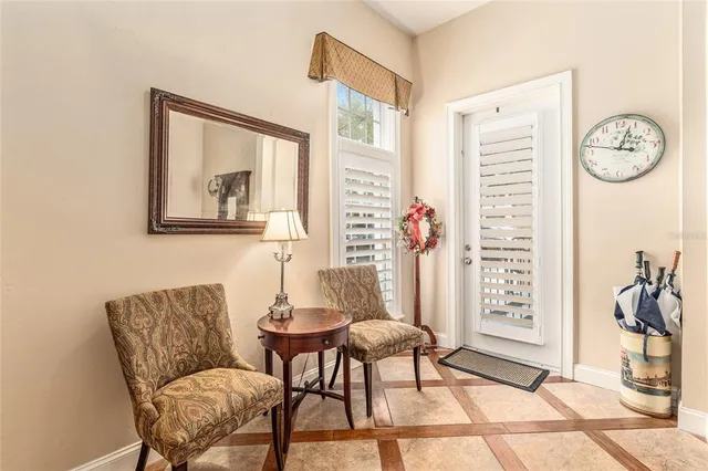 a dining room with furniture a rug and wooden floor