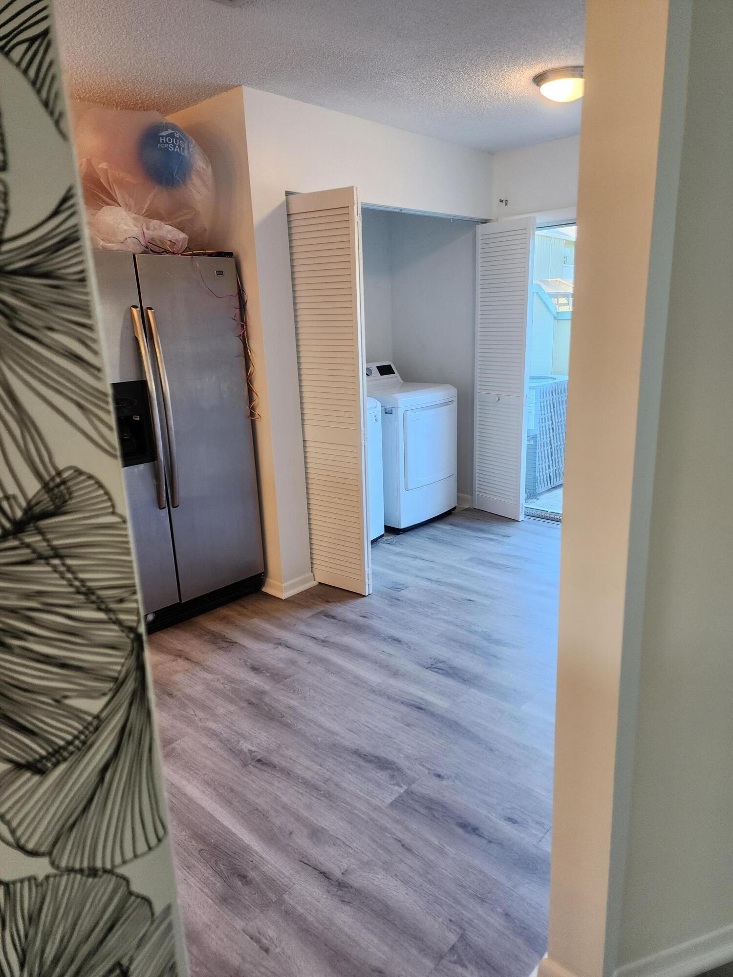 6263 Riverwalk Lane, Unit 2 Jupiter, FL 33458 - Photo 13 of 44 a view of empty room with wooden floor