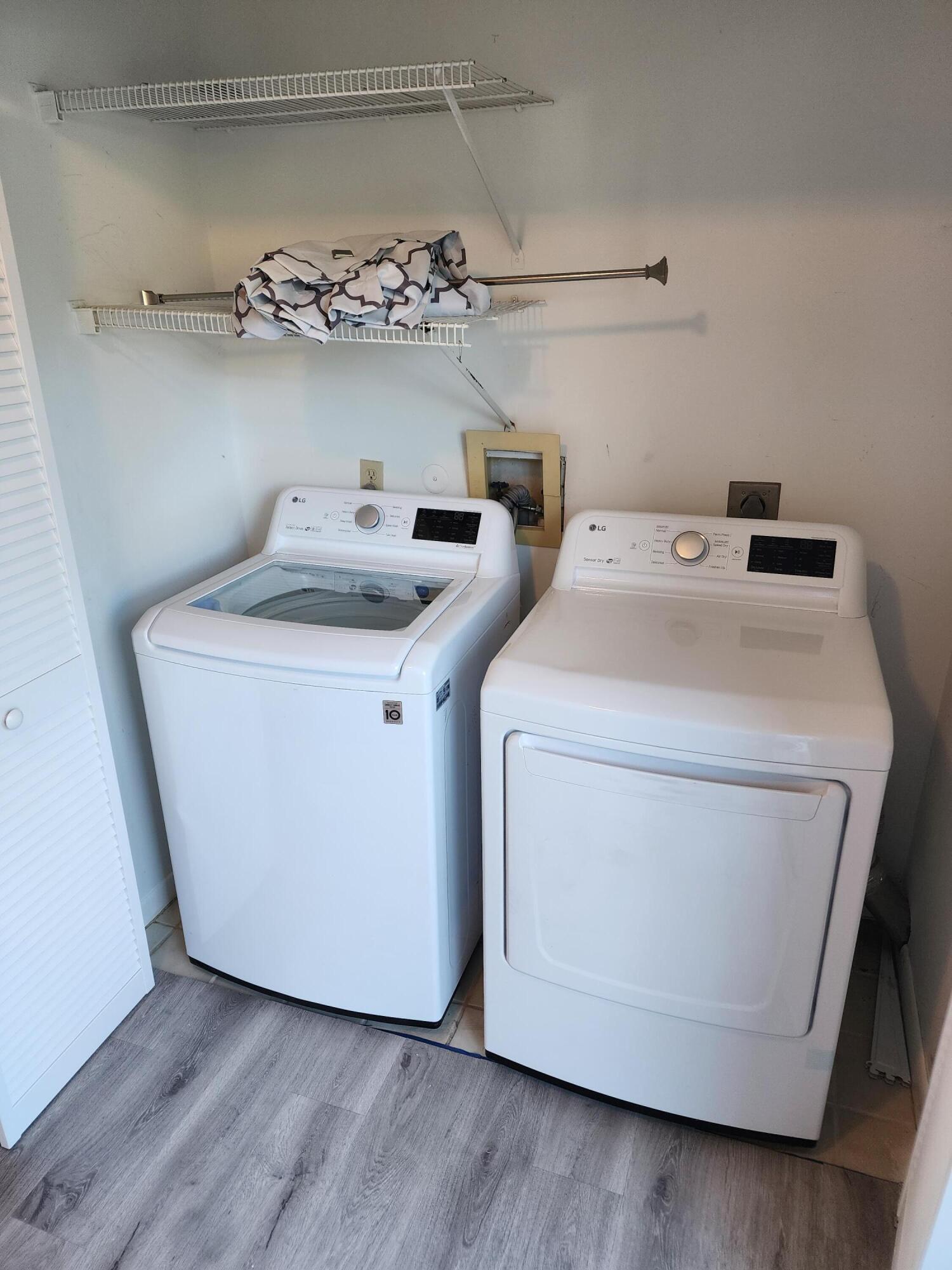 6263 Riverwalk Lane, Unit 2 Jupiter, FL 33458 - Photo 15 of 44 a utility room with dryer and washer