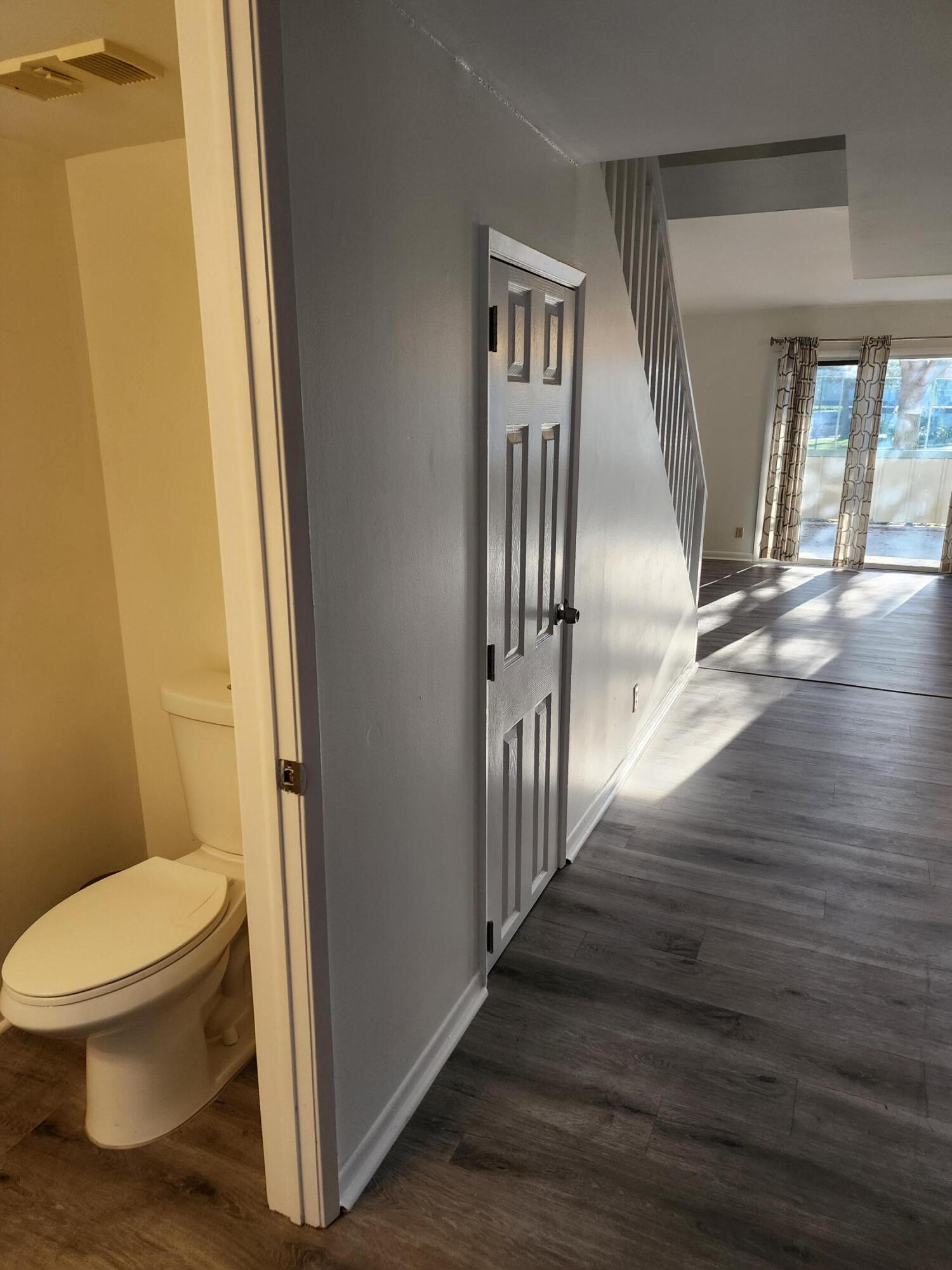 6263 Riverwalk Lane, Unit 2 Jupiter, FL 33458 - Photo 19 of 44 a bathroom with a toilet and a shower