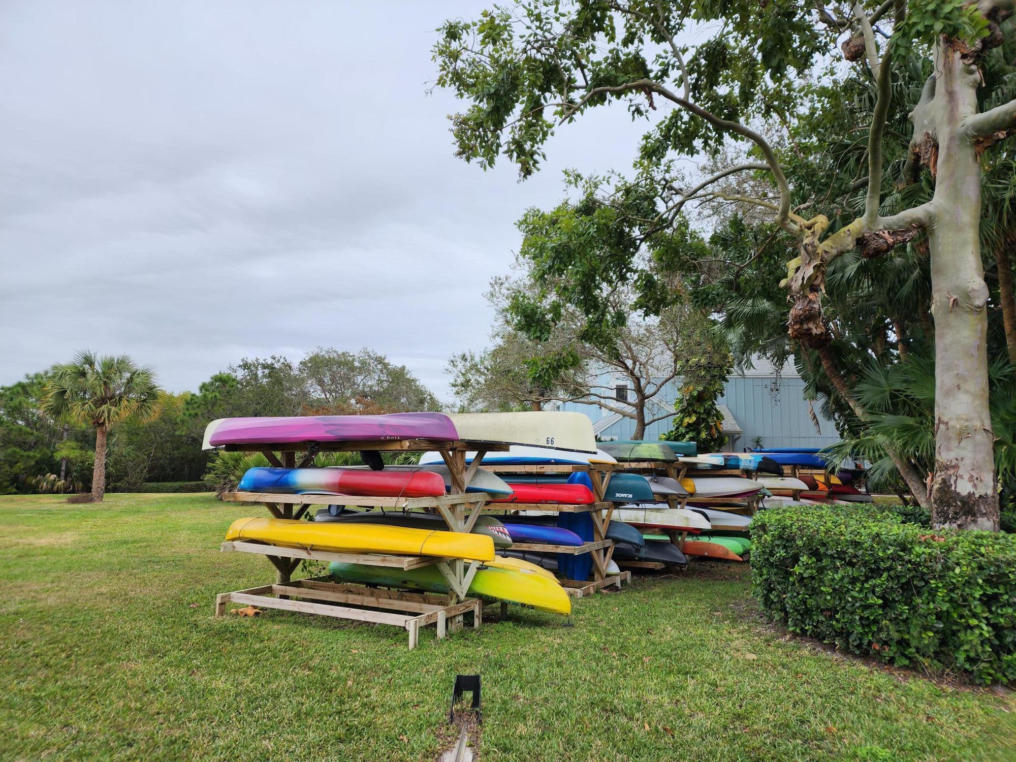 6263 Riverwalk Lane, Unit 2 Jupiter, FL 33458 - Photo 40 of 44 a bench sitting in the middle of a park