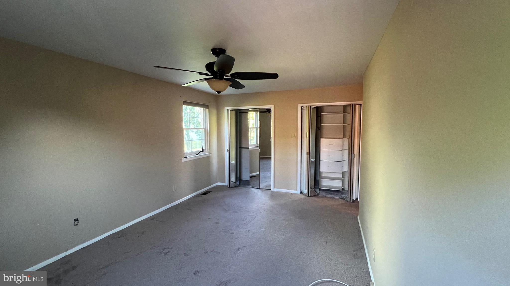 11023 Greiner Road Philadelphia, PA 19116 - Photo 17 of 29 an empty room with a ceiling fan and carpet