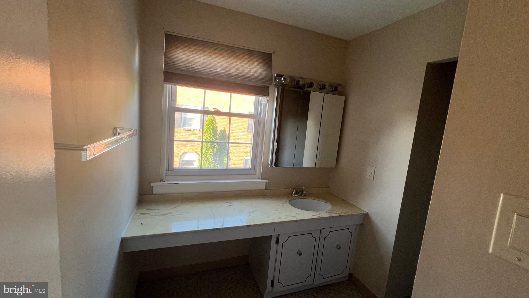 11023 Greiner Road Philadelphia, PA 19116 - Photo 19 of 29 a view of hallway with a sink and a window