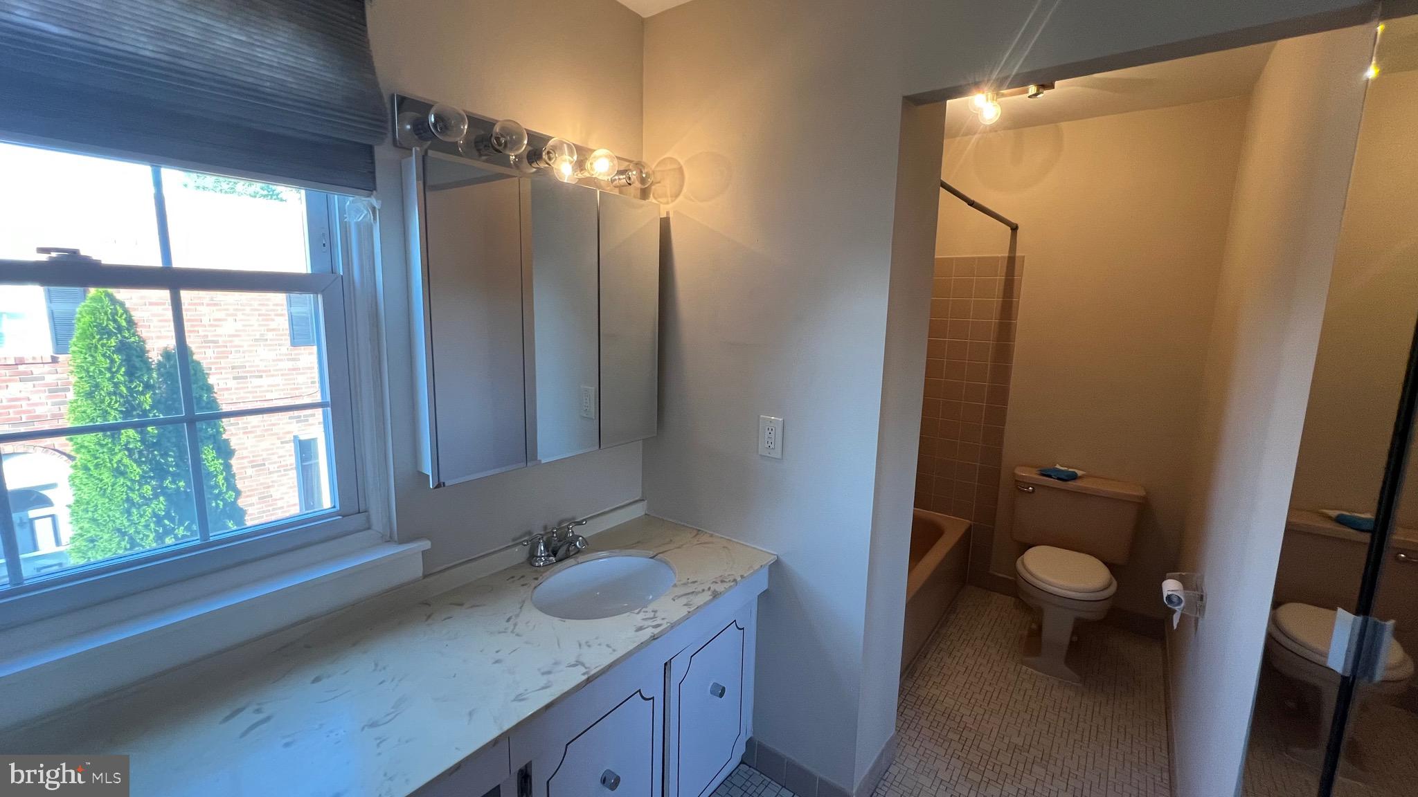 11023 Greiner Road Philadelphia, PA 19116 - Photo 20 of 29 a bathroom with a granite countertop sink toilet and shower