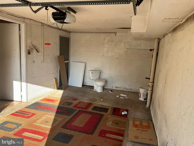 a living room with a bed