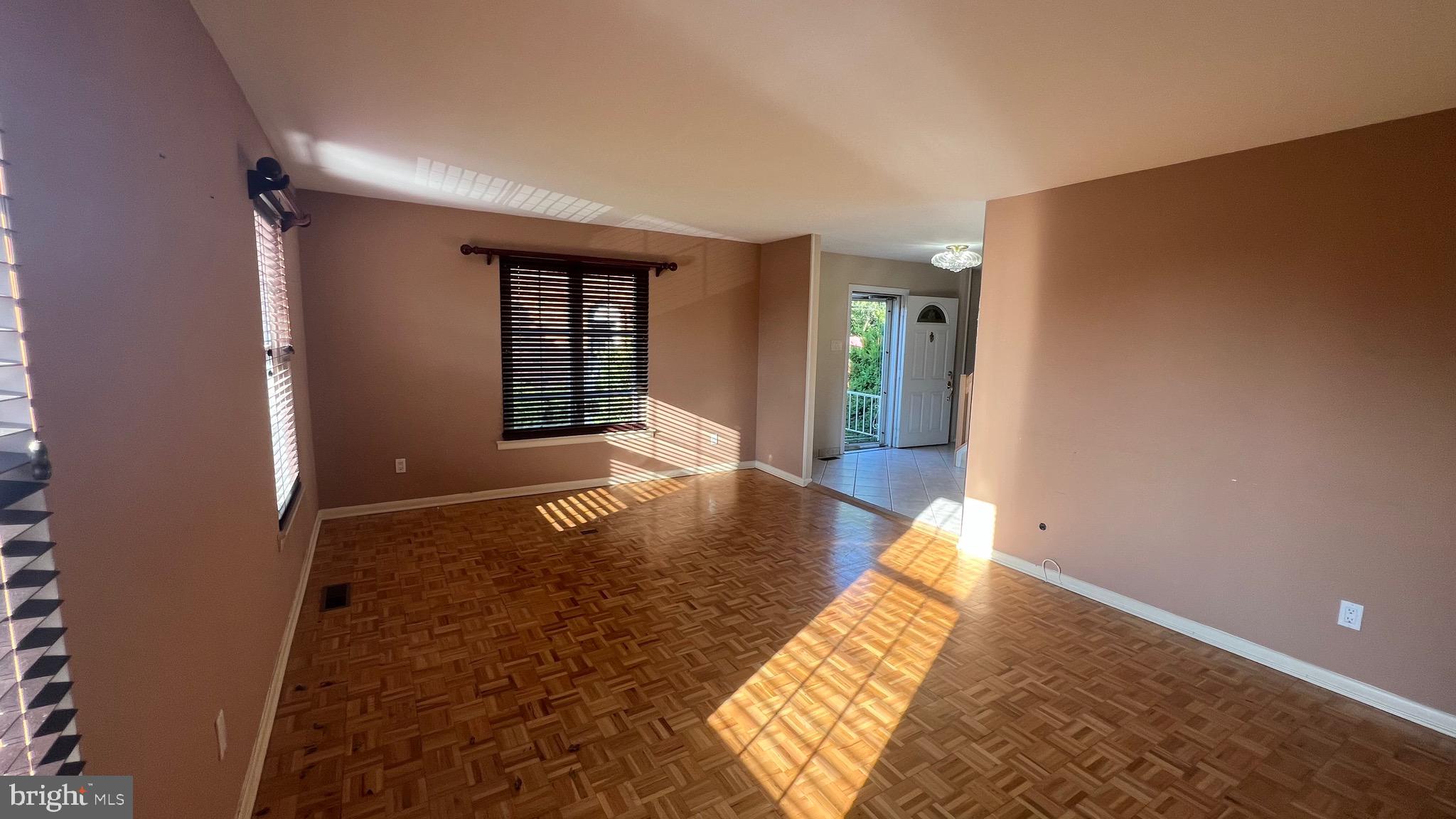 11023 Greiner Road Philadelphia, PA 19116 - Photo 3 of 29 a view of an empty room with wooden floor and a window