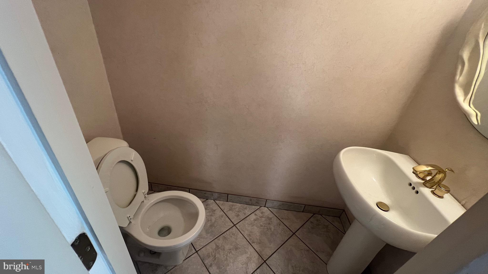 11023 Greiner Road Philadelphia, PA 19116 - Photo 10 of 29 a bathroom with a toilet and a sink