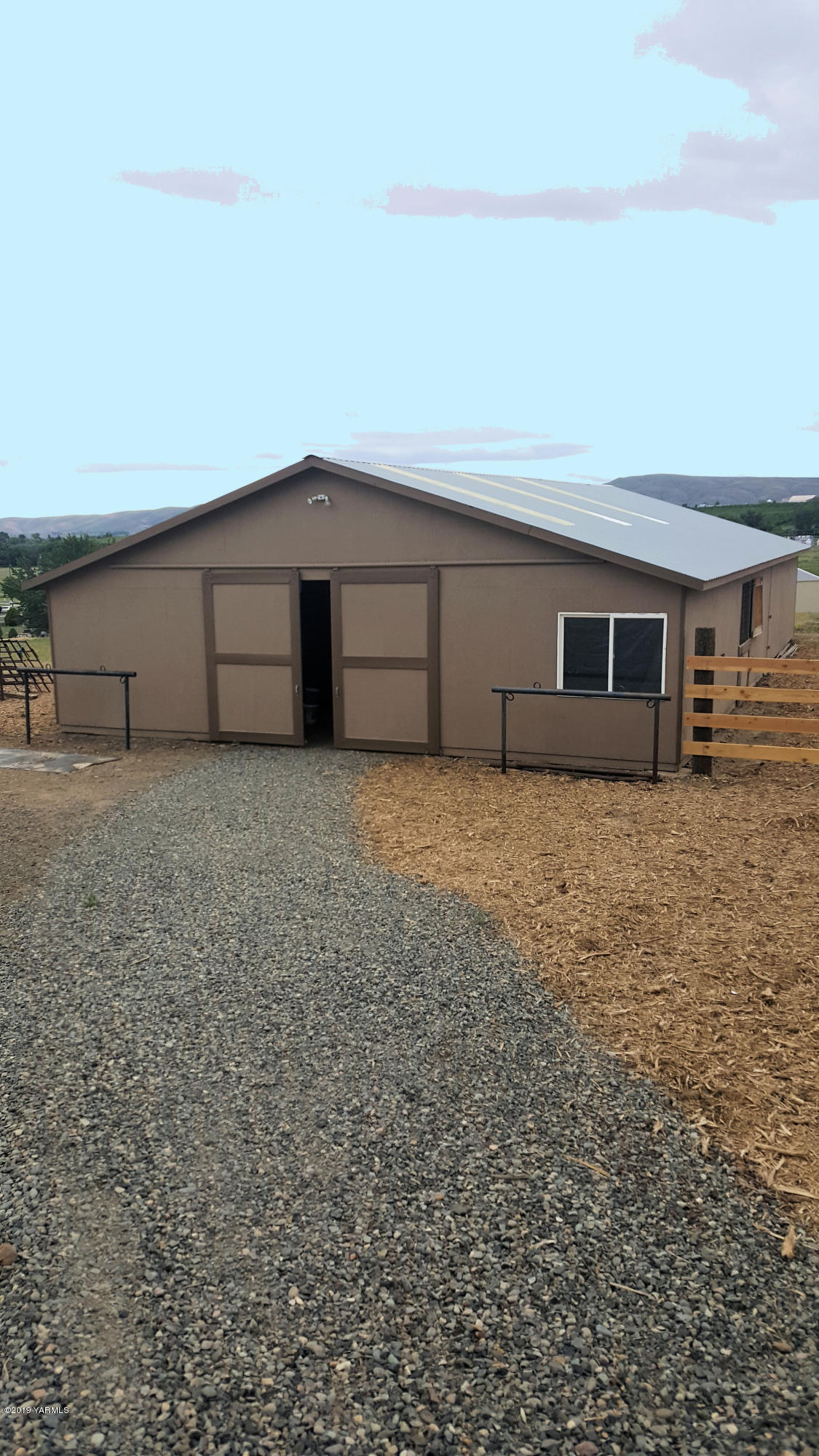 9709 Grunewald Road Yakima, WA 98908 - Photo 2 of 42 a view of a house with a garage