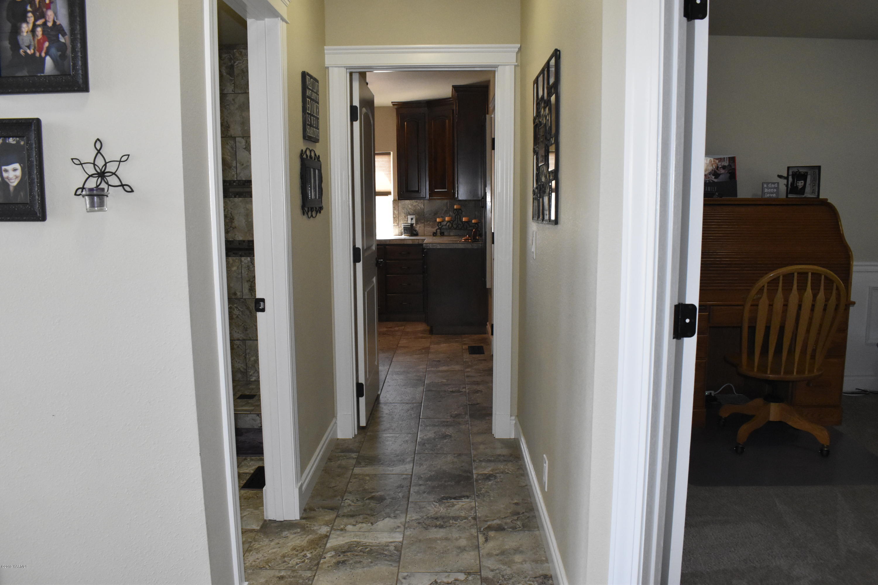 9709 Grunewald Road Yakima, WA 98908 - Photo 17 of 42 a view of a hallway with closet and a fireplace