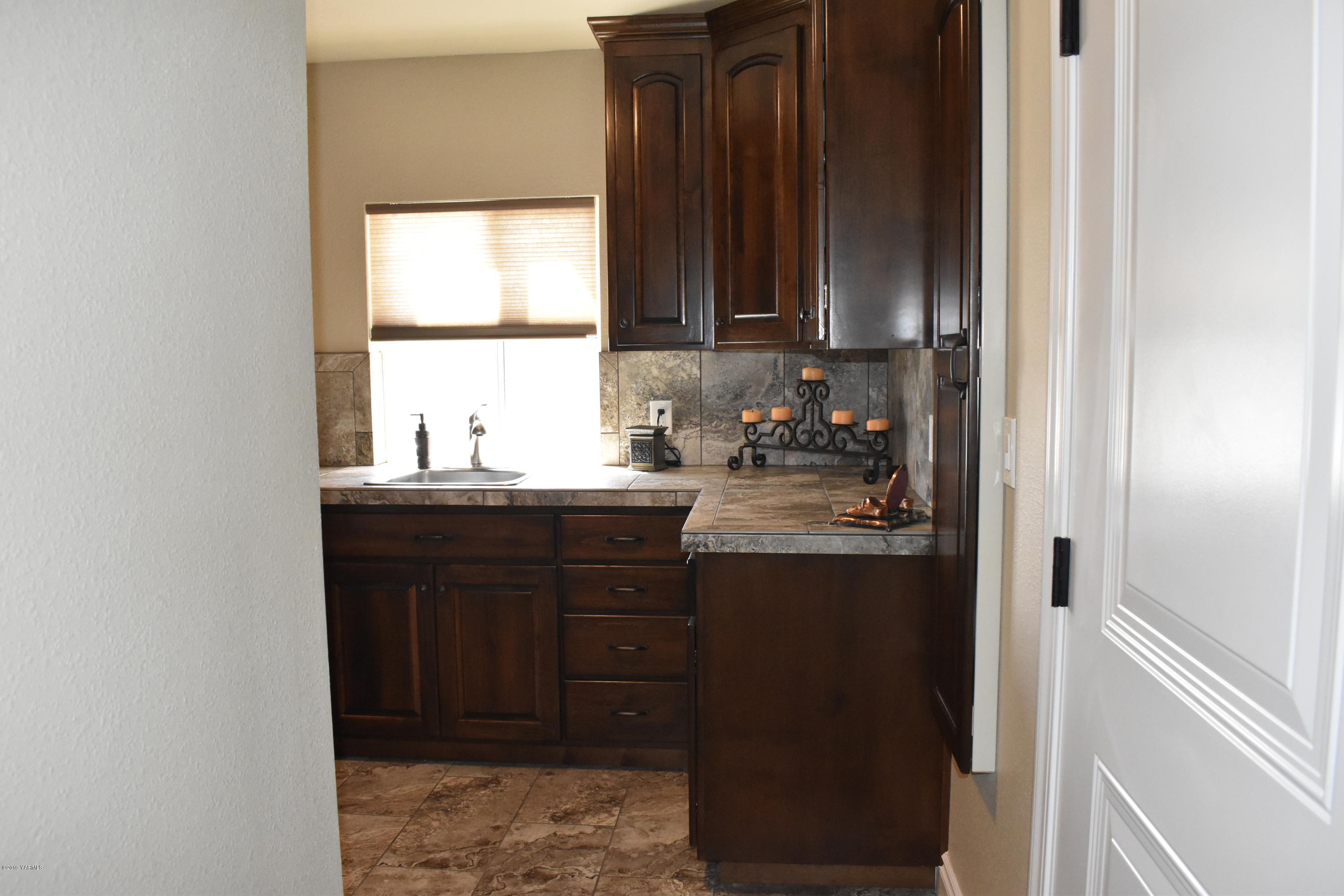 9709 Grunewald Road Yakima, WA 98908 - Photo 19 of 42 a kitchen with sink and cabinets