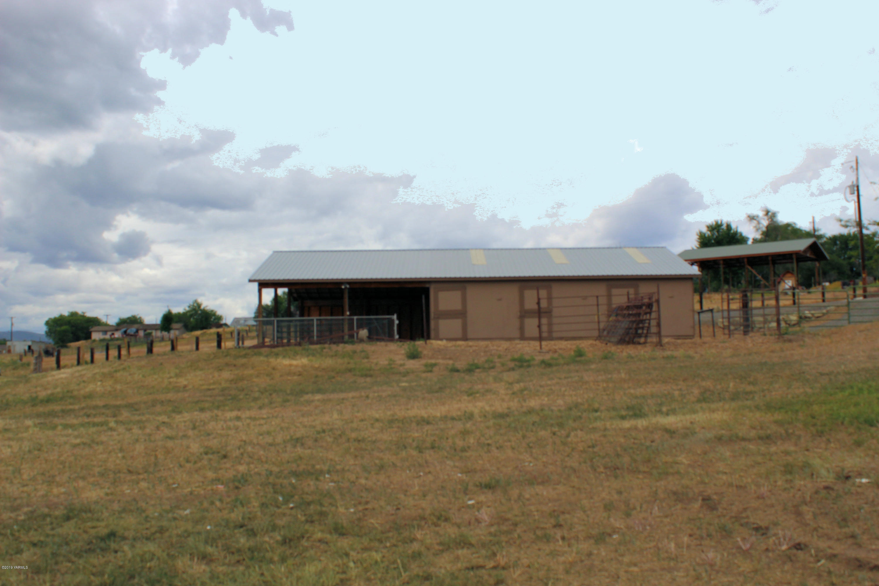 9709 Grunewald Road Yakima, WA 98908 - Photo 3 of 42 a view of a house with a yard