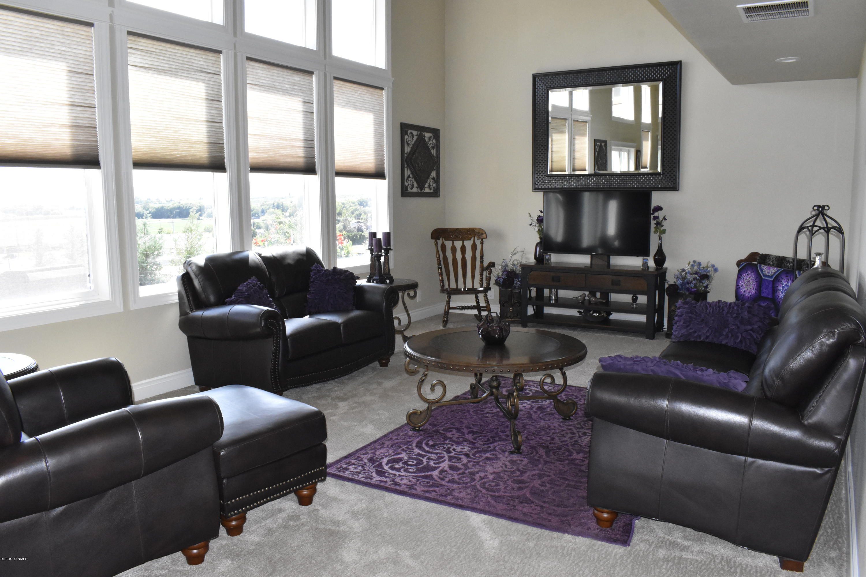 9709 Grunewald Road Yakima, WA 98908 - Photo 22 of 42 a living room with furniture or couch and a floor to ceiling window