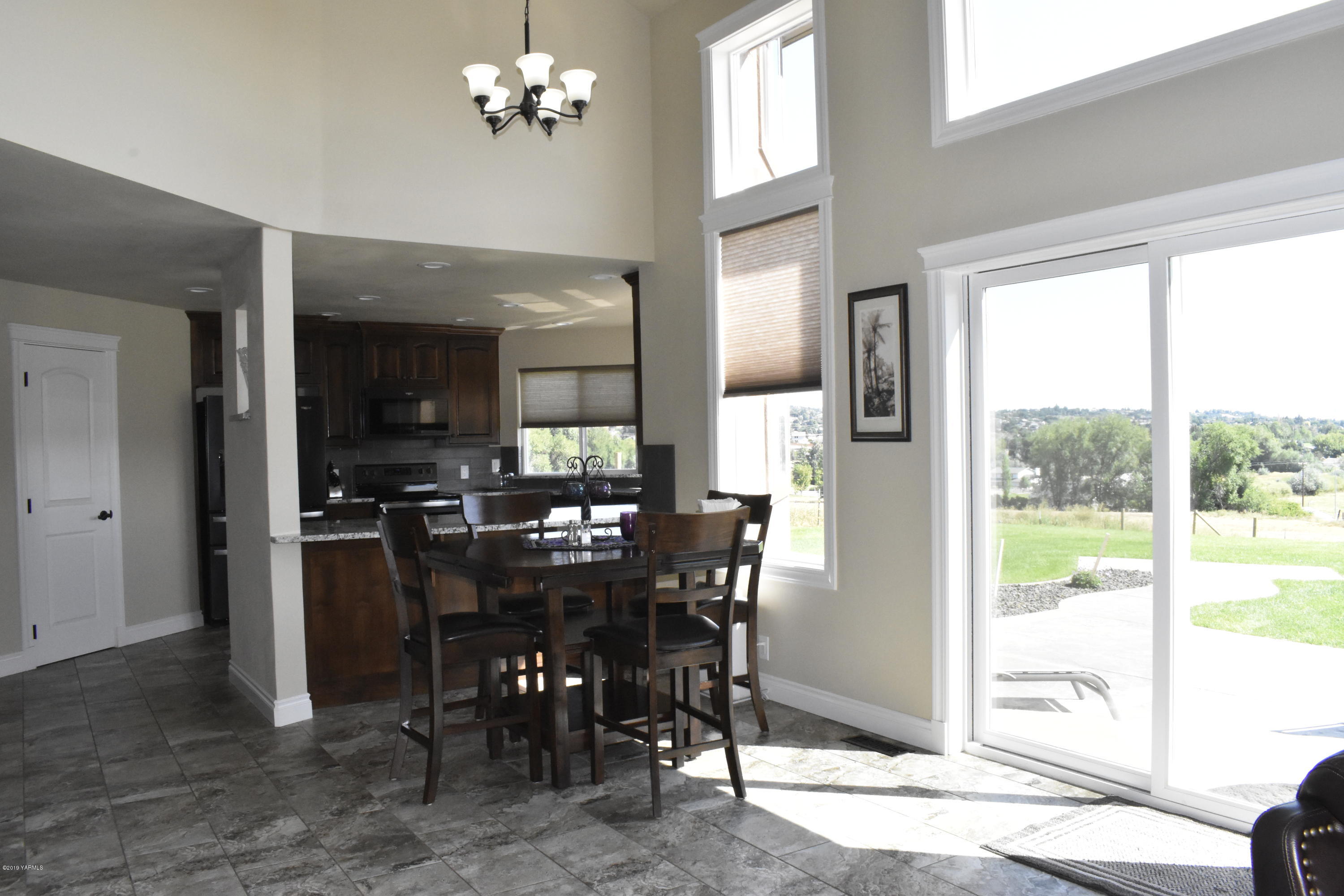 9709 Grunewald Road Yakima, WA 98908 - Photo 24 of 42 a view of a dining room with furniture window and outside view