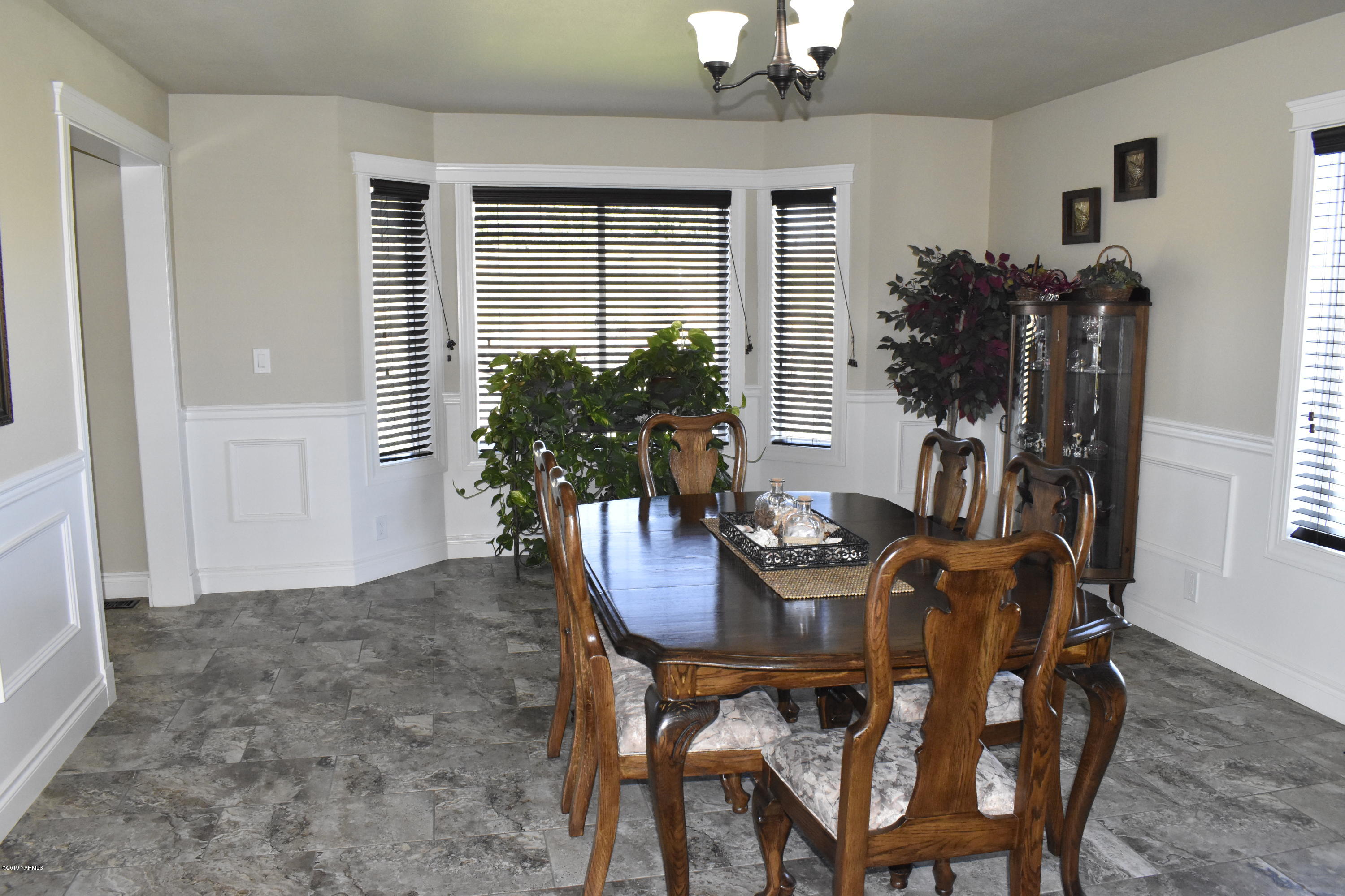 9709 Grunewald Road Yakima, WA 98908 - Photo 28 of 42 a view of a dining room with furniture and window