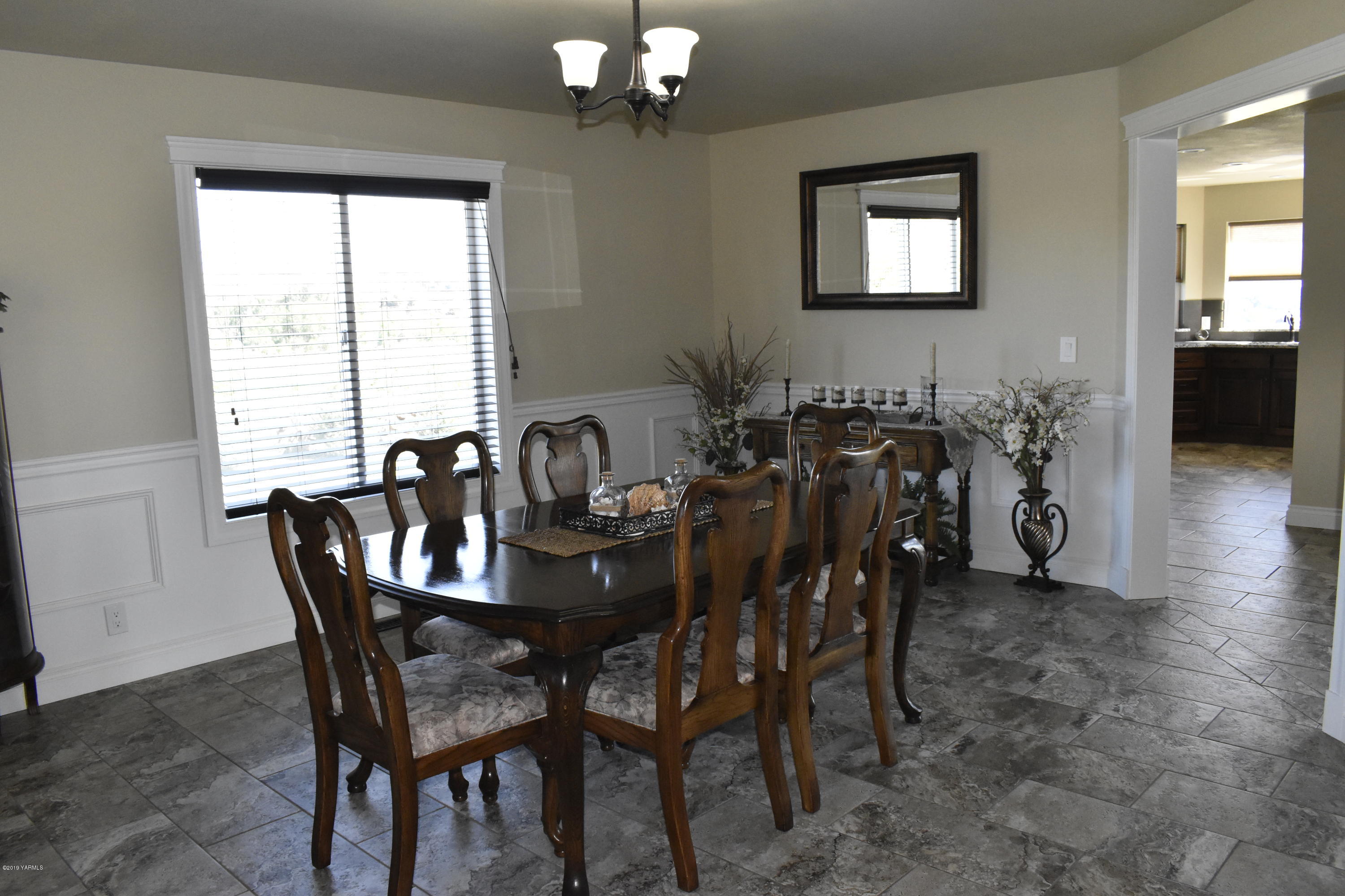 9709 Grunewald Road Yakima, WA 98908 - Photo 29 of 42 a view of a dining room with furniture and chandelier